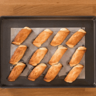 People holding up Cheese Rolls
